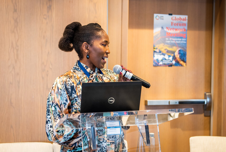 Woman speaking at a conference 